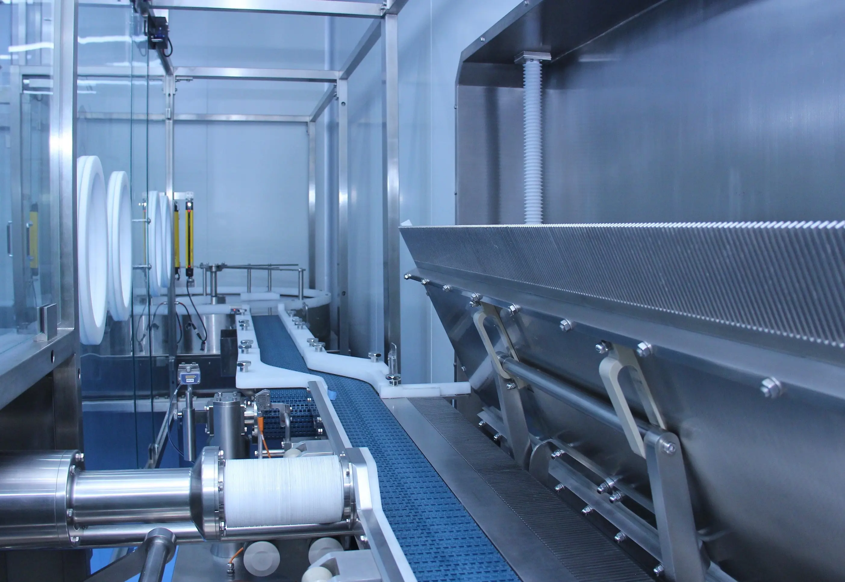 Conveyor and stainless filling enclosure inside the production line