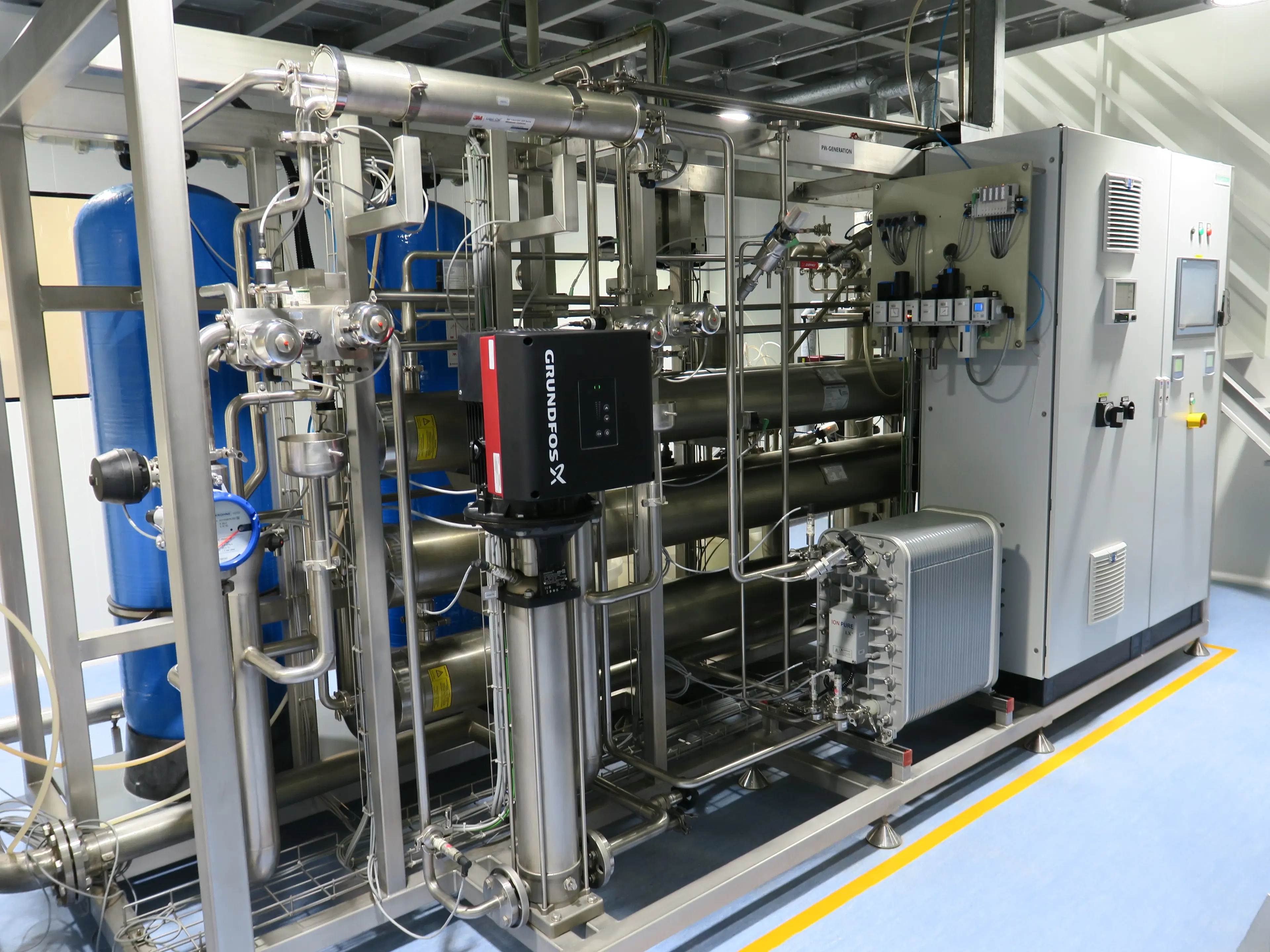 Water treatment and purification skid with blue storage tanks