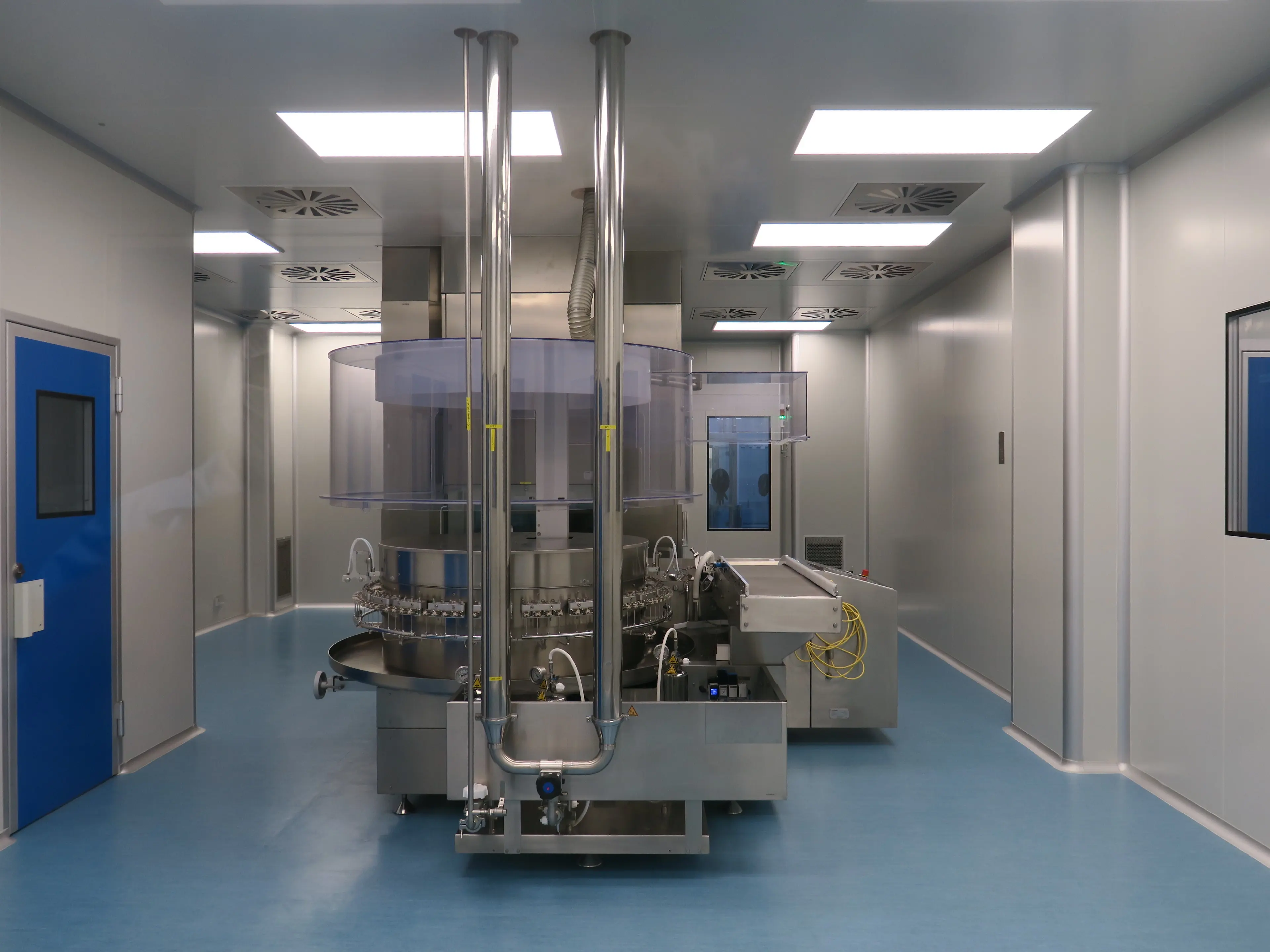 Cleanroom production equipment with a blue personnel door